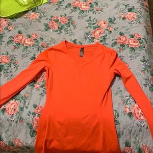 a neon pink under armor shirt